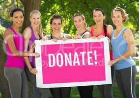Donate text and pink breast cancer awareness women holding card