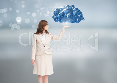 Businesswoman with open hand with cog gears
