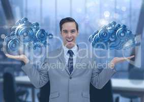 Businessman with open hands and cog gears clouds