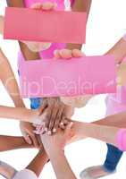 Hands holding card with pink breast cancer awareness women