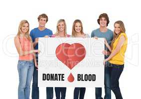 Students holding a sign with donate blood text