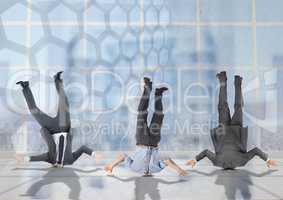 3 business people stuck upside down with transition background