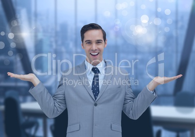 Businessman with hands open in office