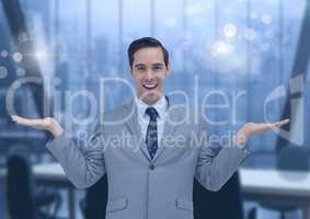 Businessman with hands open in office