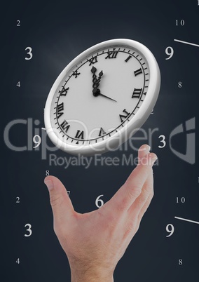 Hand holding a clock against background with clocks