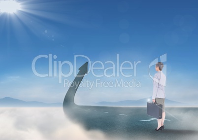 businesswoman on street arrow pointing up in clouds