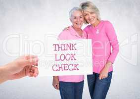 Think Look Check Text and Hand holding card with pink breast cancer awareness women