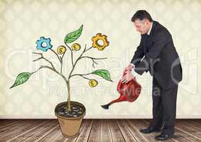 Man holding watering can and Drawing of Business graphics on plant branches on wall
