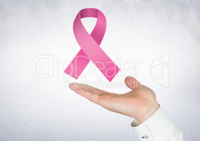 Open hand with pink ribbon for breast cancer awareness