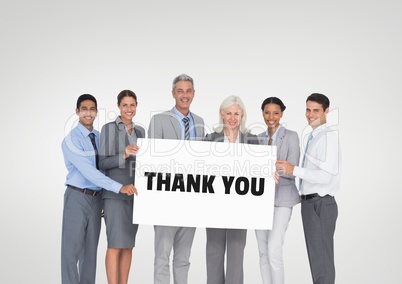 Business people holding a card with thank you text