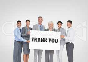 Business people holding a card with thank you text