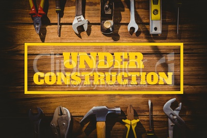 Under construction text against tools photo