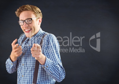 Nerd man pointing against navy chalkboard