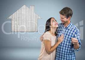 Couple Holding key with house icon in front of vignette