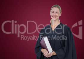 Female judge with book against maroon background