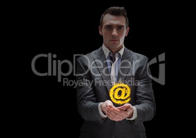 businessman with hands spread of with @ fire icon over. Black background