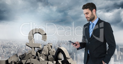 Broken concrete stone with money pound symbol and businessman in cityscape