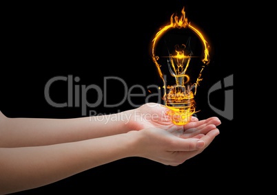 hands with light  fire icon over. Black background