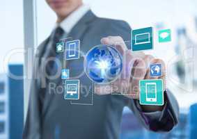 businessman with hand spread of  taking earth with application icons. Business blurred background