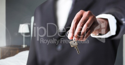 Hand Holding key  in bedroom