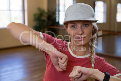 Portrait of young woman practicing dance