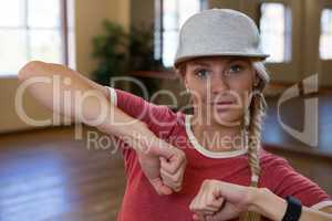 Portrait of young woman practicing dance