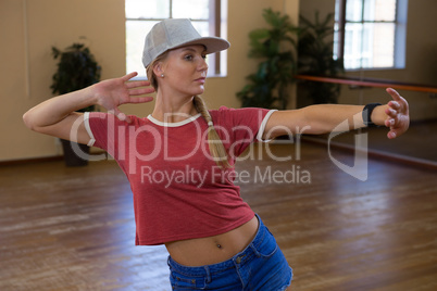 Young dancer practicing in studio