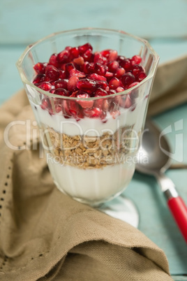 Cup of yogurt with raspberry and pomegranate