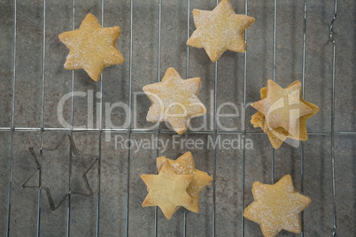 Overhead view of star shape cookies on cooling rack