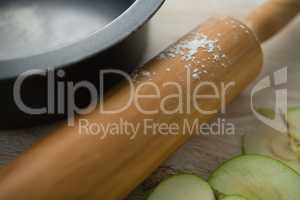 Close up of rolling pin by container