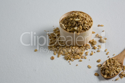 Oat flakes in a wooden bowl and spoon