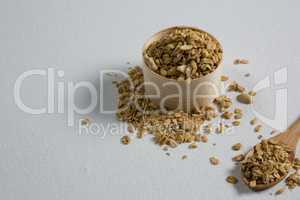 Oat flakes in a wooden bowl and spoon