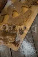 High angle view of dough with on cutting board