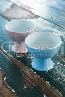 Two ceramic bowls on wooden table