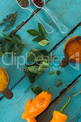Various spices and herbs on wooden table