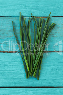 Garlic chives on wooden table