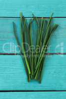 Garlic chives on wooden table