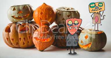 Cartoon Monsters standing with halloween pumpkins