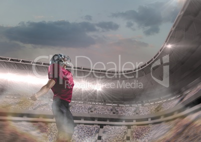 american football player standing in stadium american football player standing in stadium