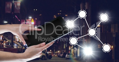Hand holding tablet with icons interface of internet of things