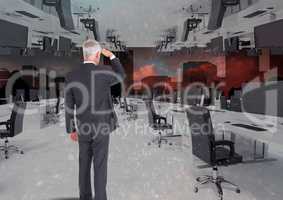 businessman standing in inverted office with skyline