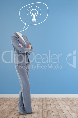 Composite image of headless businesswoman standing with arms crossed