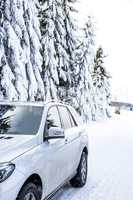Car in snow-covered winter scenery