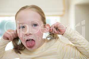 Young girl making funny faces