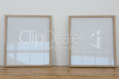 Frames arranged on wooden table