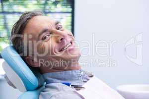 Portrait of smiling man sitting on chair