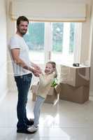 Father and daughter having fun in living room