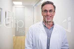 Dentist standing at lobby in dental clinic