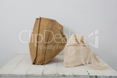 Brown and beige bags on table