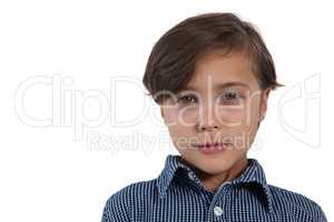 Cute boy standing against white background